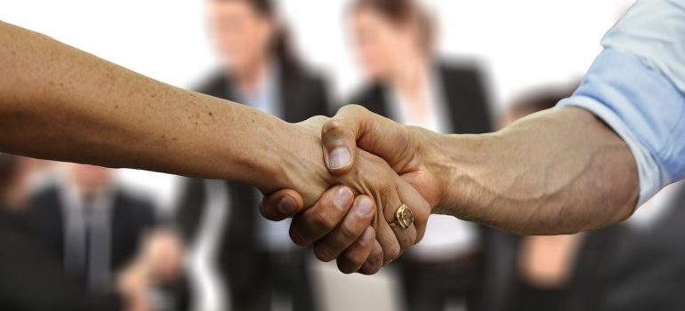 A handshake between two people.