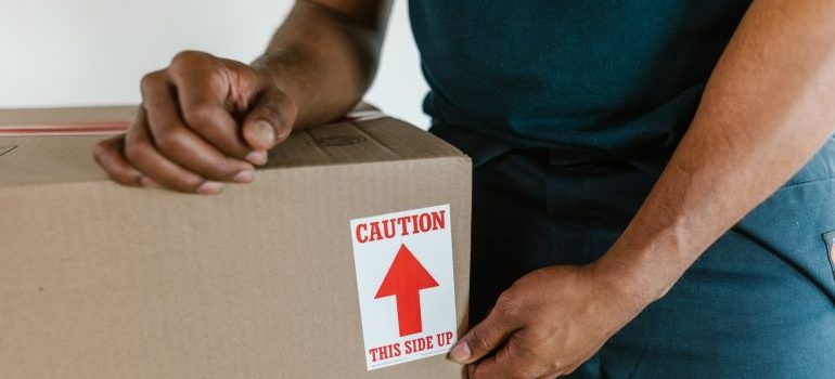 A man packing a moving box