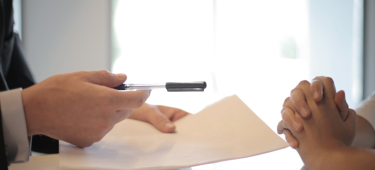 A person signing a contract
