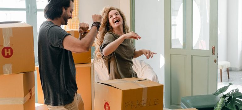 A happy couple and moving boxes 