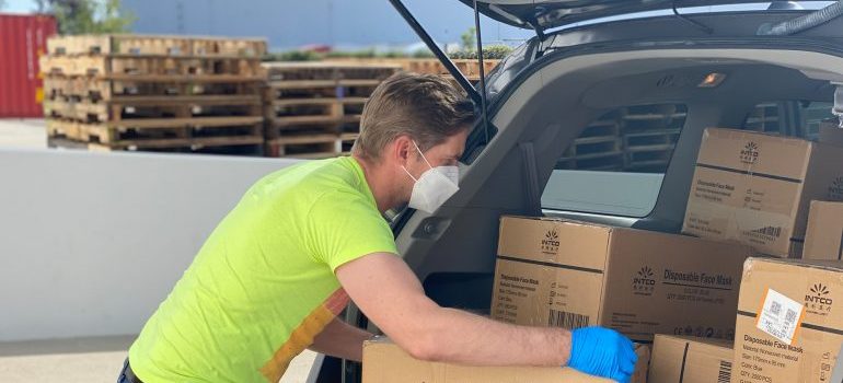 man loading the moving boxes