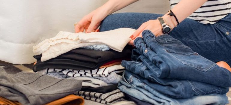 person folding clothes
