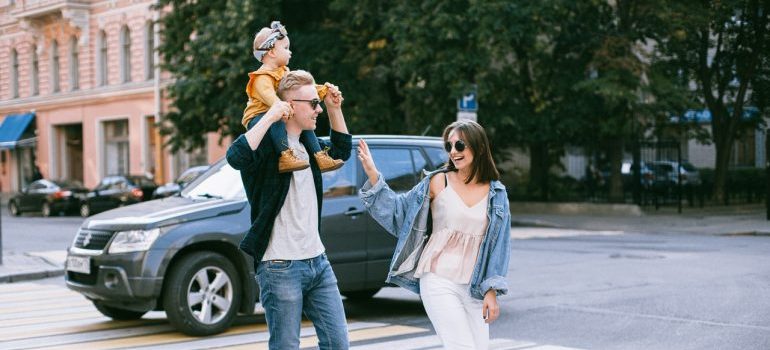 A family crossing the street.