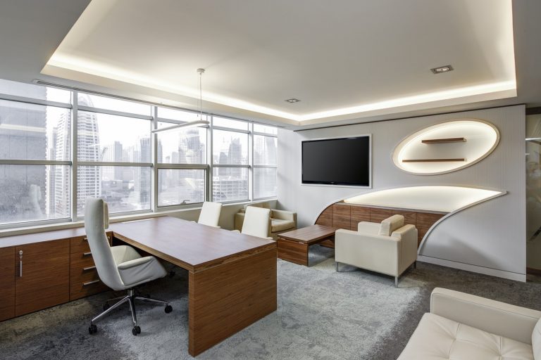 white office with desk and chairs