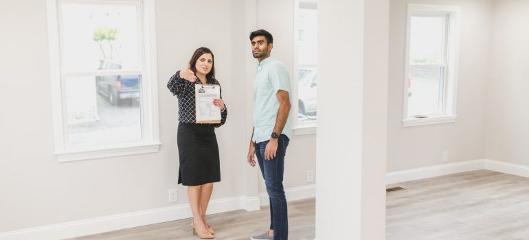 a man talking to his real estate agent prior to buying a property in Toronto