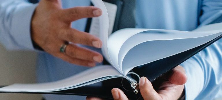 man holding documents