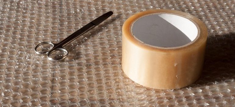 Bubble wrap, packing tape and scissors 