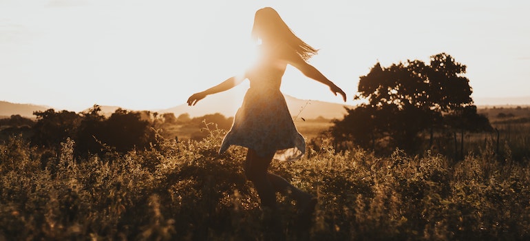 A woman enjoying sun in the nature