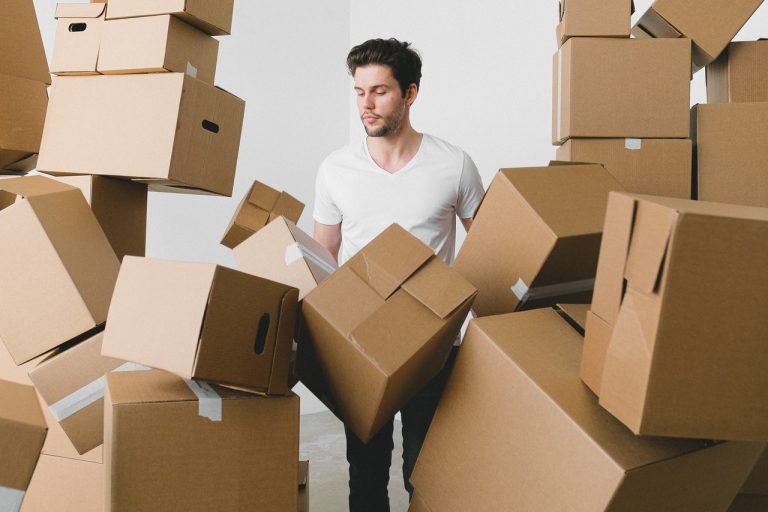 man with too many boxes