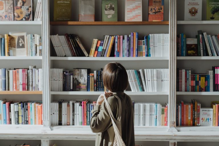 Woman looking at a bookshelf