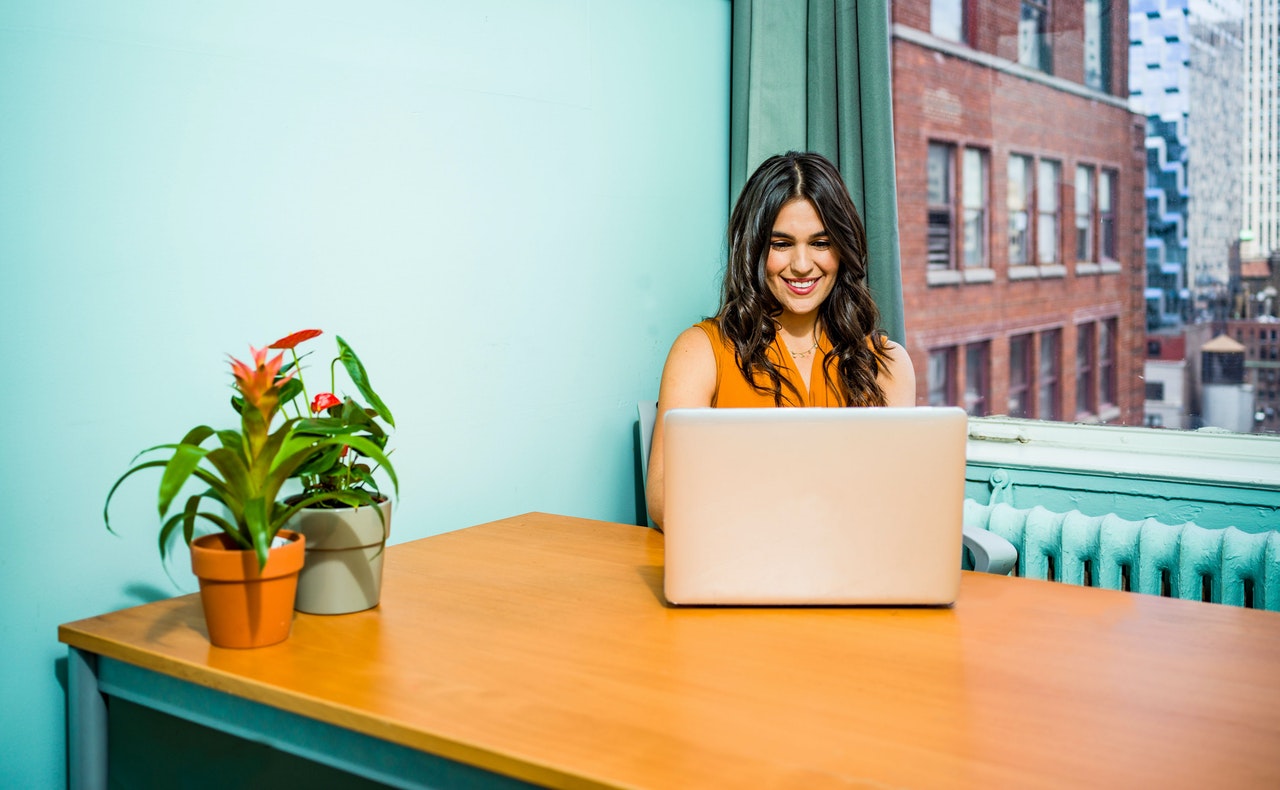 Woman in beautiful office using a laptop