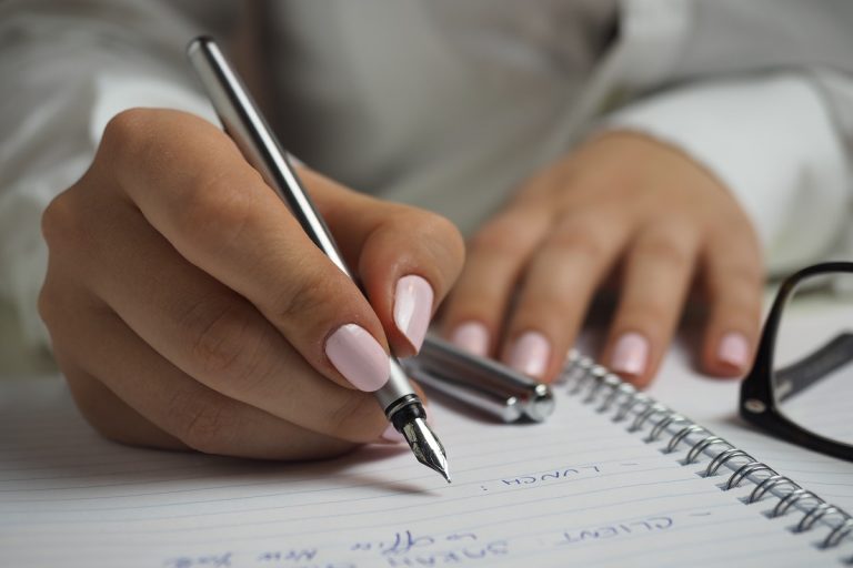 writing down the tasks to do before the movers arrive