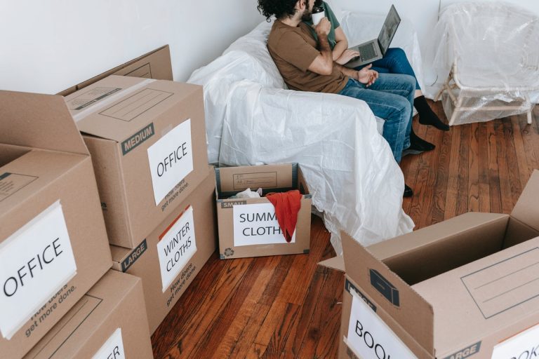 couple and packed boxes for move to Oakville