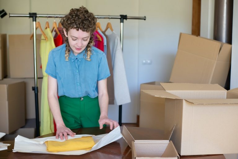 Woman wrapping clothes