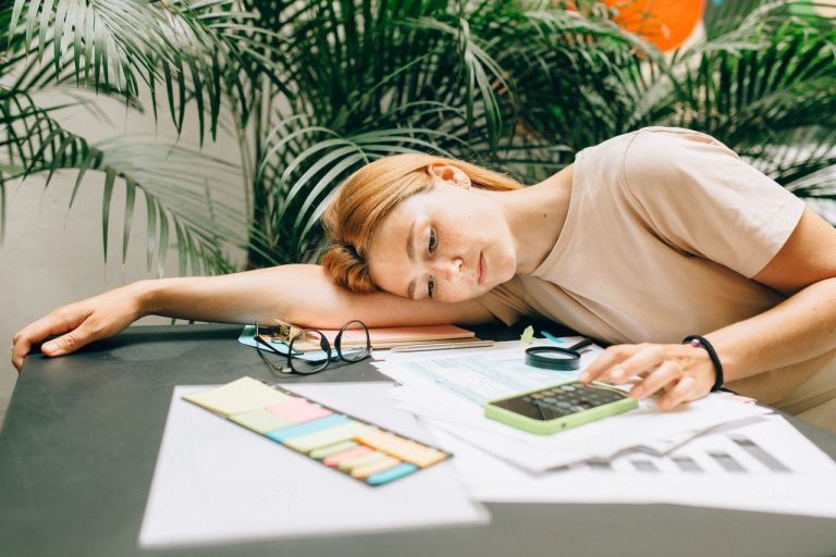 A woman stressed with all the costs of her move
