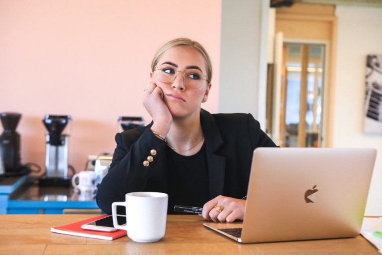 a woman thinking about pros and cons of moving into a bigger house