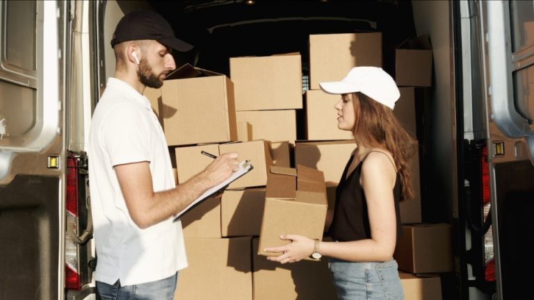 man and woman talking about why you should buy new moving boxes
