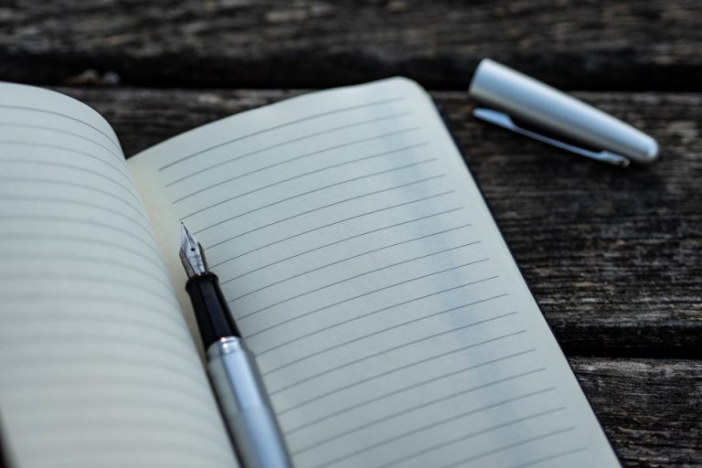 a pen inside a notebook
