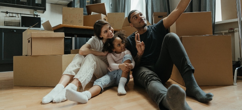 a family taking a selfie before moving to Mallorytown vs. Brockville