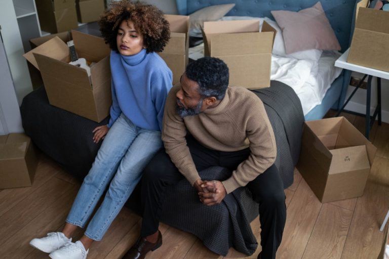 Couple thinking about how to make a smart choice of moving services when moving on a budget