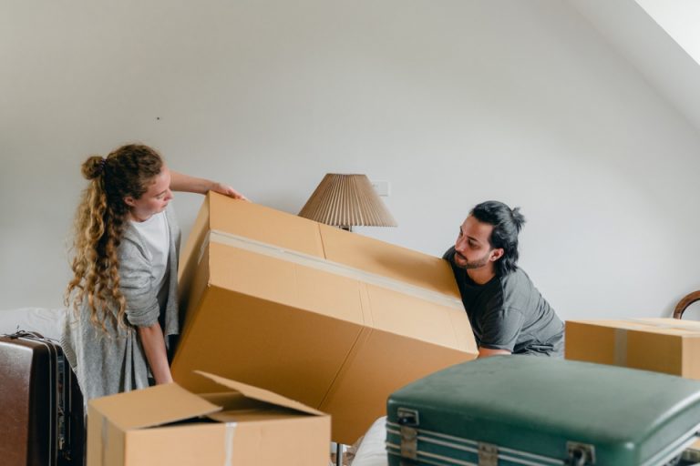 People moving their packed boxes