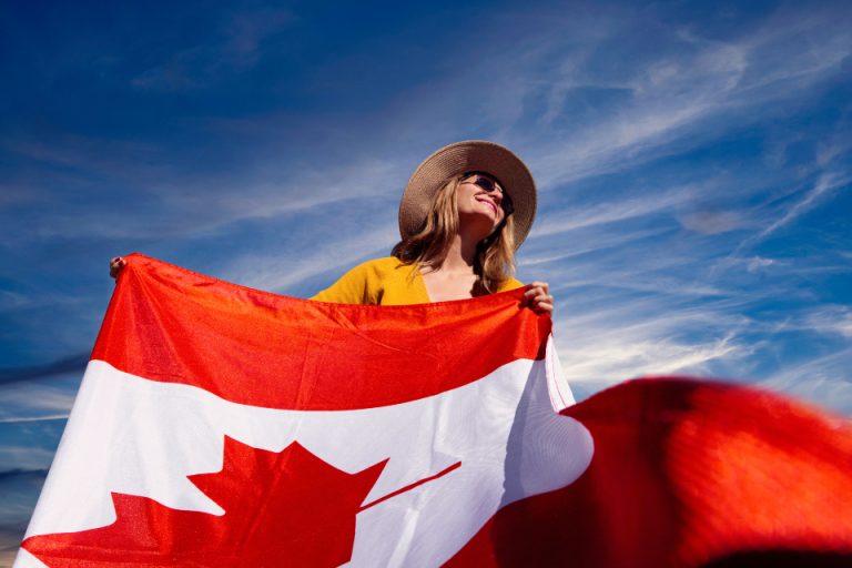 A girl holding Canada flag