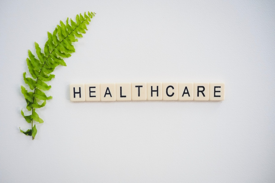 A healthcare sign next to a leaf