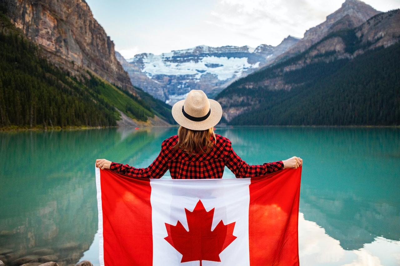 A girl holding Canada flag in Aurora