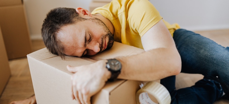 A person on a cardboard box