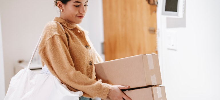 A woman with packed boxes