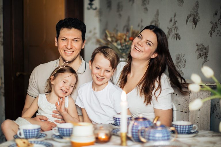 Parents with their children smiling and getting ready for moving to Toronto with kids