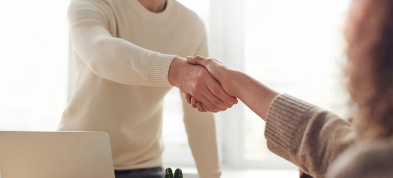 People shaking hands in an office