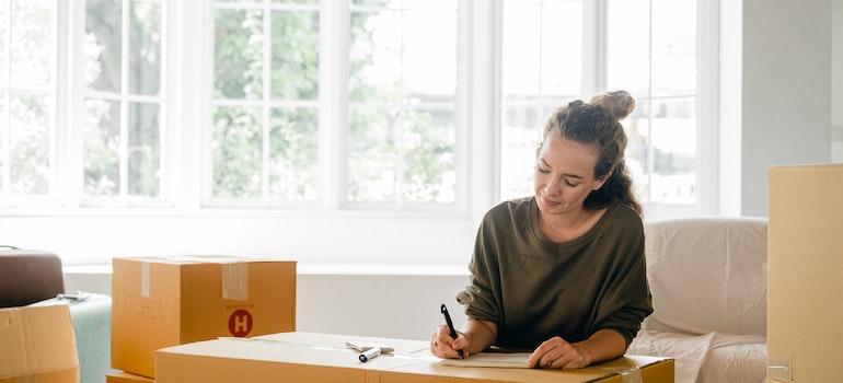 A woman packing for a move