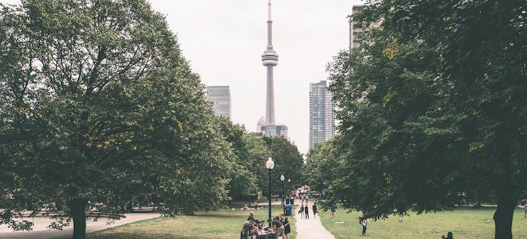 A CN Tower in Toronto seen from a park