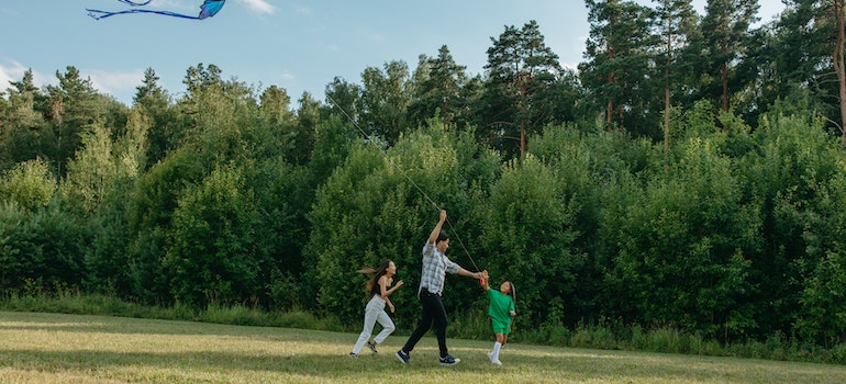 A family playing with a kite