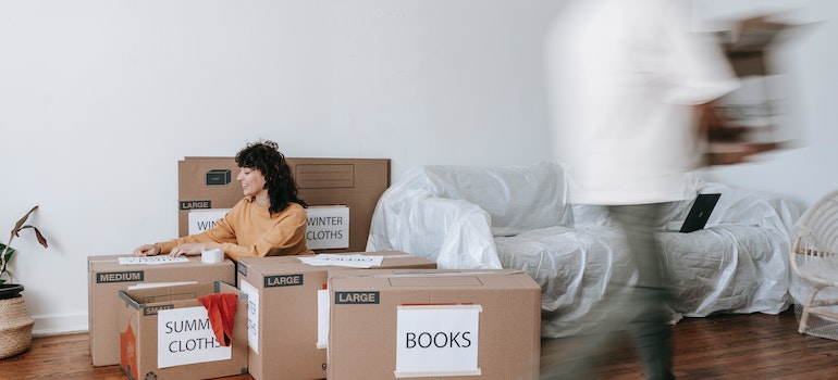 A woman packing for a move