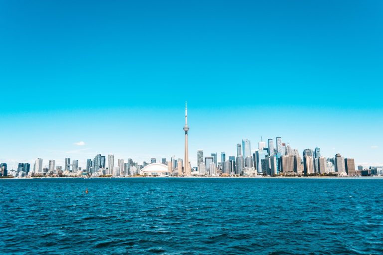 Lake Ontarion and Toronto buildings under the clear blue sky