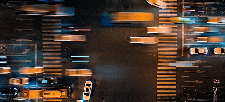 A photo of blurred cars on a road during the night