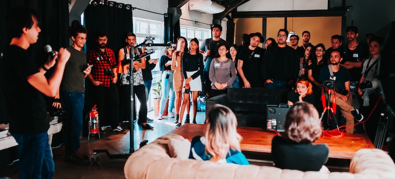 People gathered and listening to a live gig