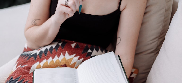A woman making a list of things to avoid after moving to Toronto