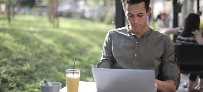 A man looking at his laptop