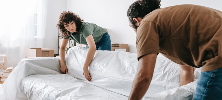 A couple packing to move and enjoy romantic spots in Canada