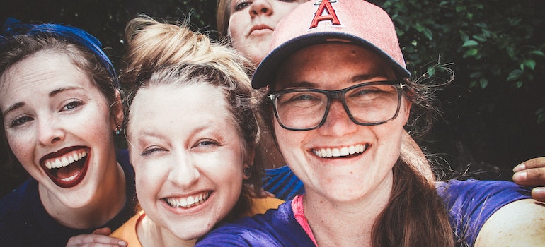 Teenagers taking a selfie and smiling