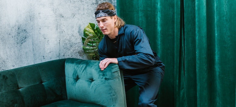 A mover holding a couch