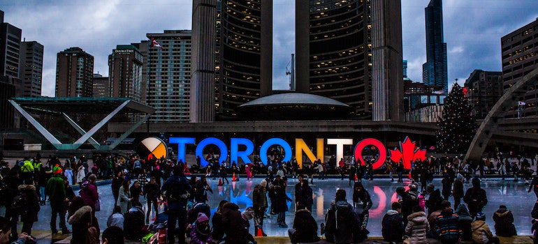 People gathered in fron of Toronto sign