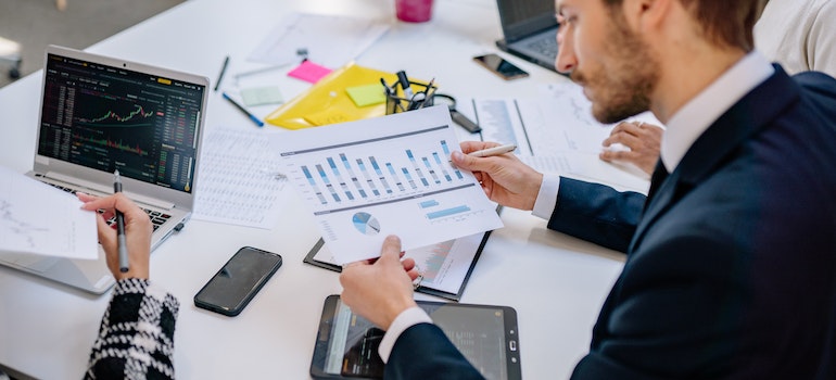 A man looking at price changes when it comes to real estate market in Ontario