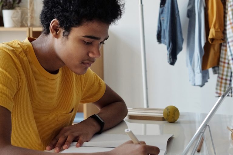 a student writing down something