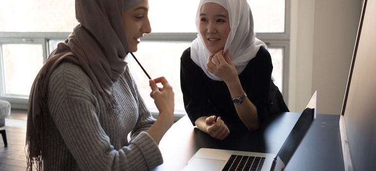 two multiracial students talking about their student life in GTA