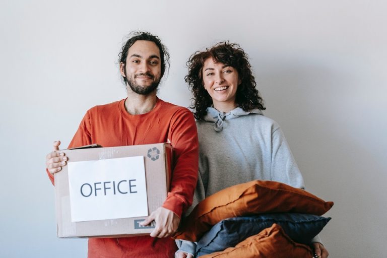 a couple with a moving box labelled 'office'