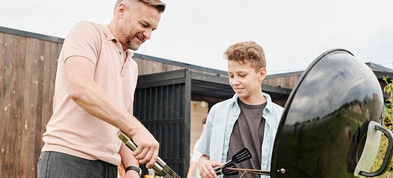 a father and a son having a BBC